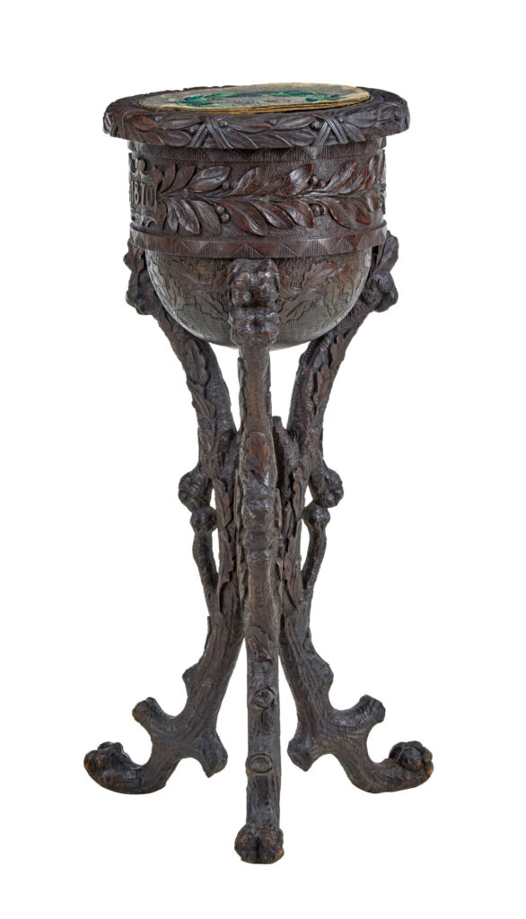 19TH CENTURY CARVED OAK BLACK FOREST CADDY ON STAND