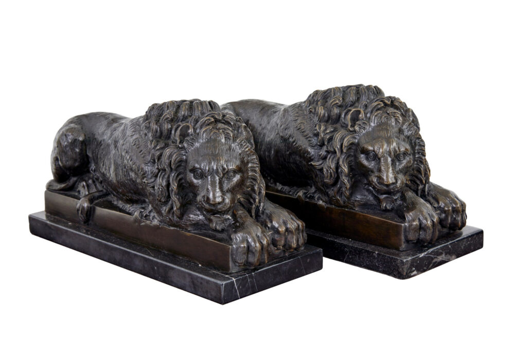 PAIR OF BRONZE AND MARBLE LION BOOK ENDS