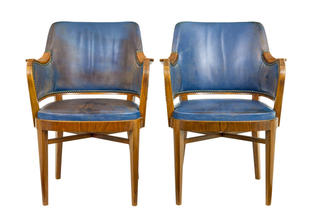 PAIR OF MID 20TH CENTURY TEAK AND LEATHER ARMCHAIRS