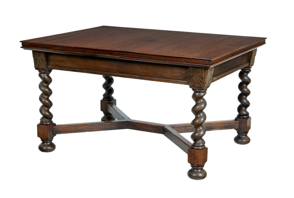 EARLY 20TH CENTURY BAROQUE REVIVAL OAK EXTENDING DINING TABLE