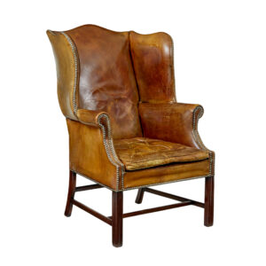 EARLY 20TH CENTURY TAN LEATHER WING BACK ARMCHAIR