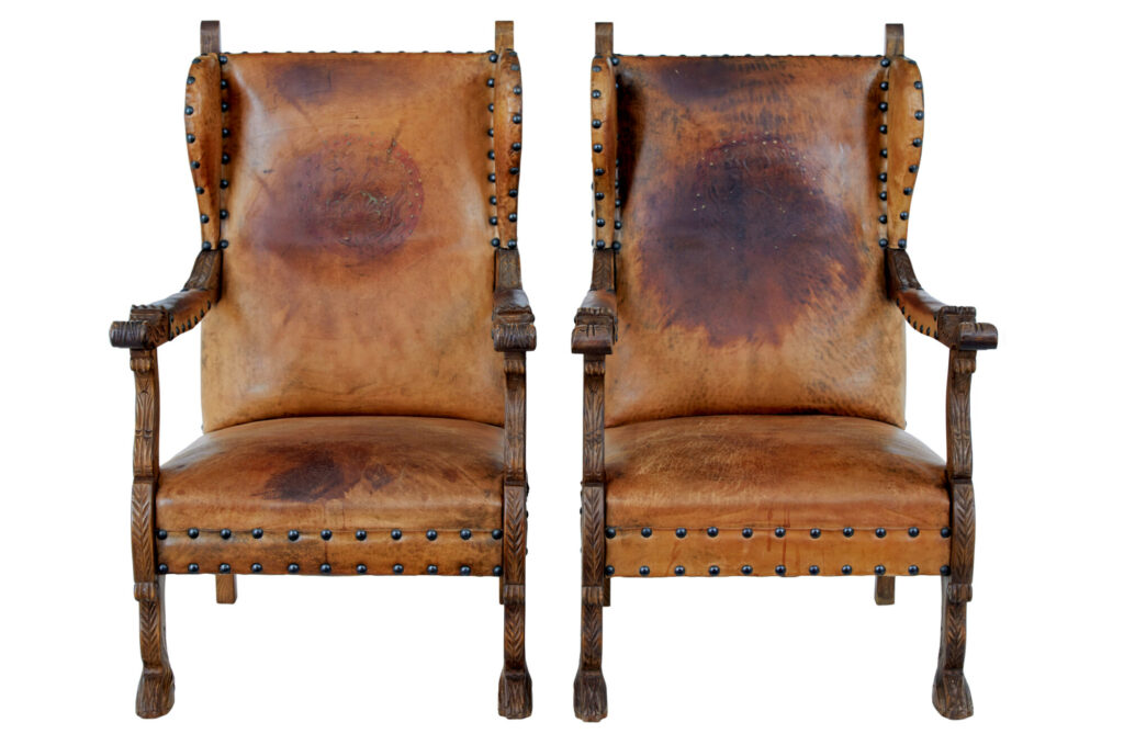 PAIR OF 19TH CENTURY CARVED OAK AND LEATHER ARMCHAIRS