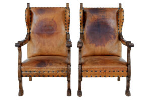 PAIR OF 19TH CENTURY CARVED OAK AND LEATHER ARMCHAIRS
