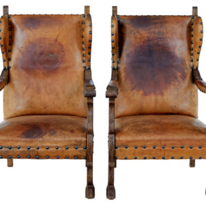 PAIR OF 19TH CENTURY CARVED OAK AND LEATHER ARMCHAIRS